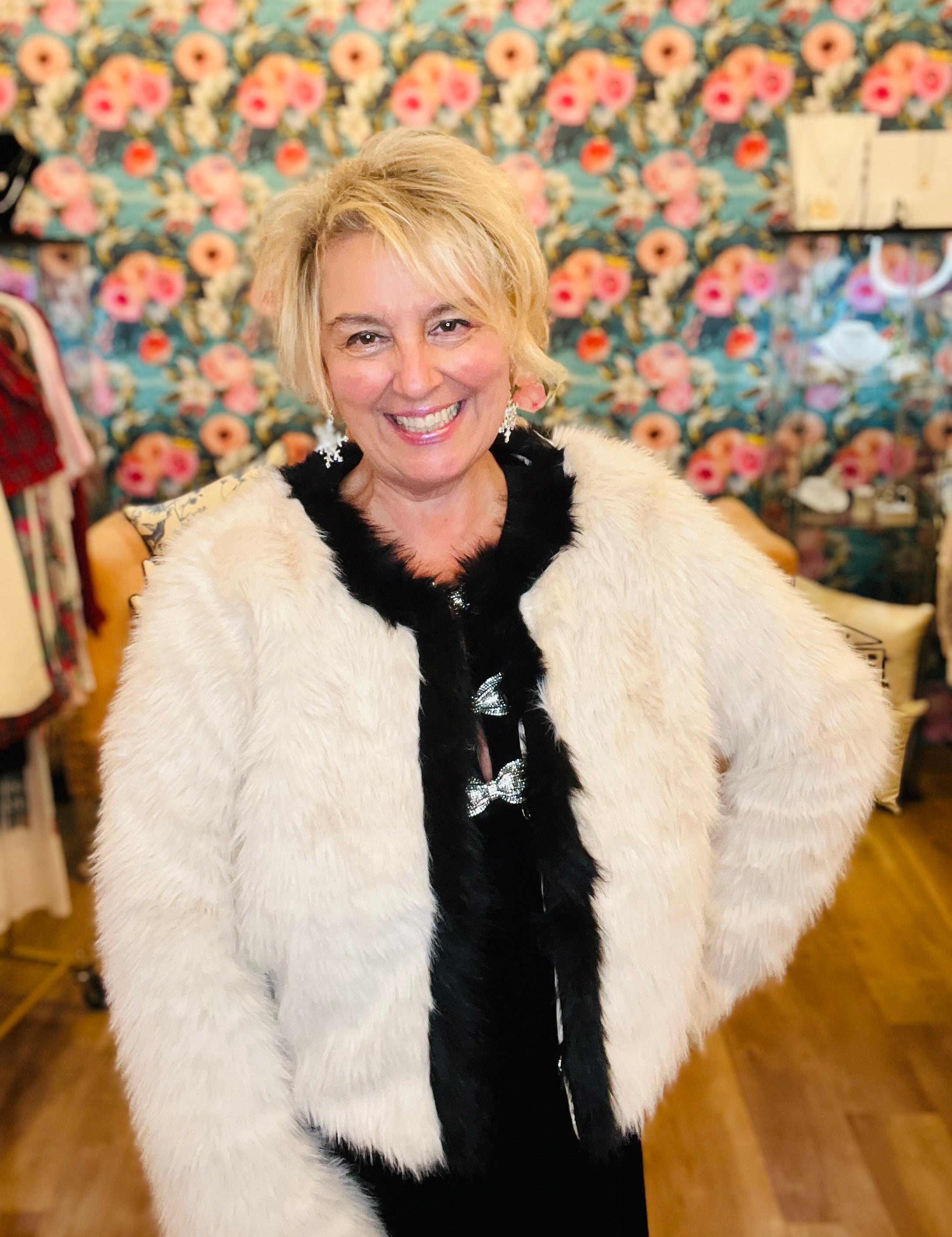 Cream faux fur jacket with black contrast trim details