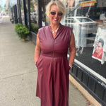 Faux patent leather dress with zipper & smocking details