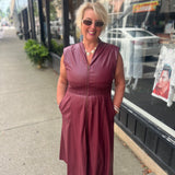 Faux patent leather dress with zipper & smocking details