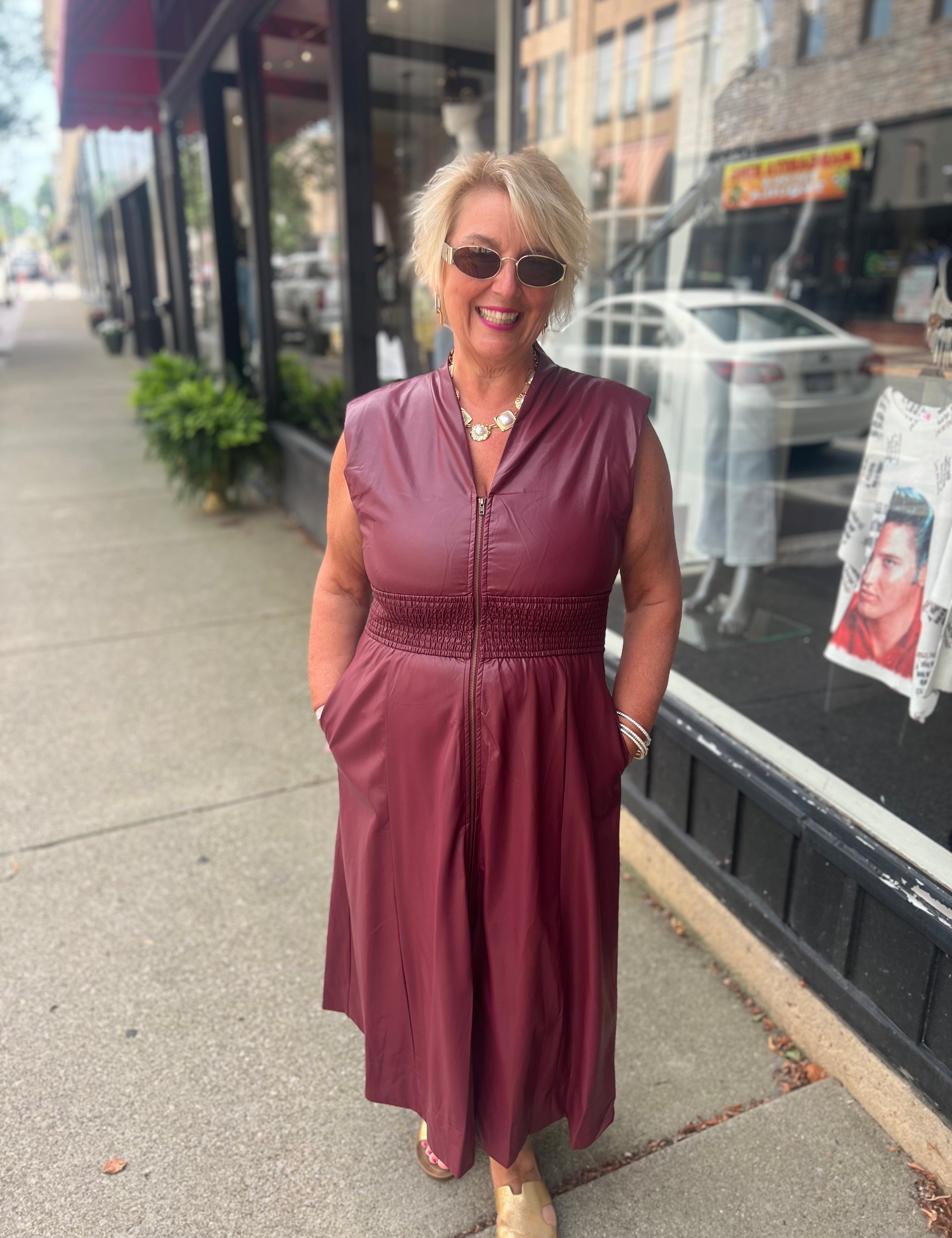 Faux patent leather dress with zipper & smocking details