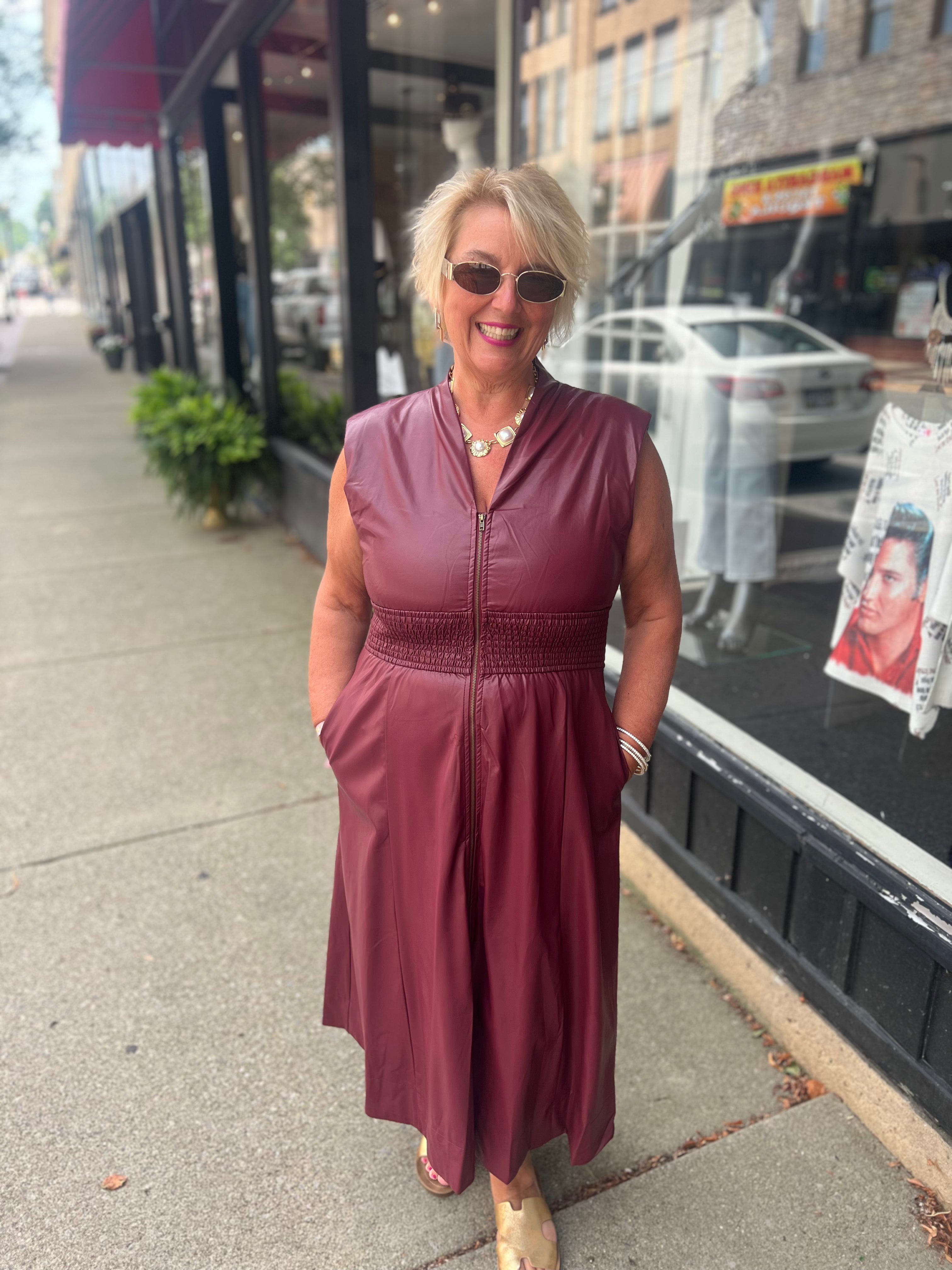 Faux patent leather dress with zipper & smocking details