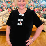 Christine in black velvet bow dress