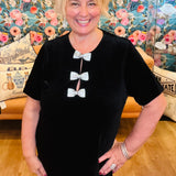 Christine in black velvet bow dress